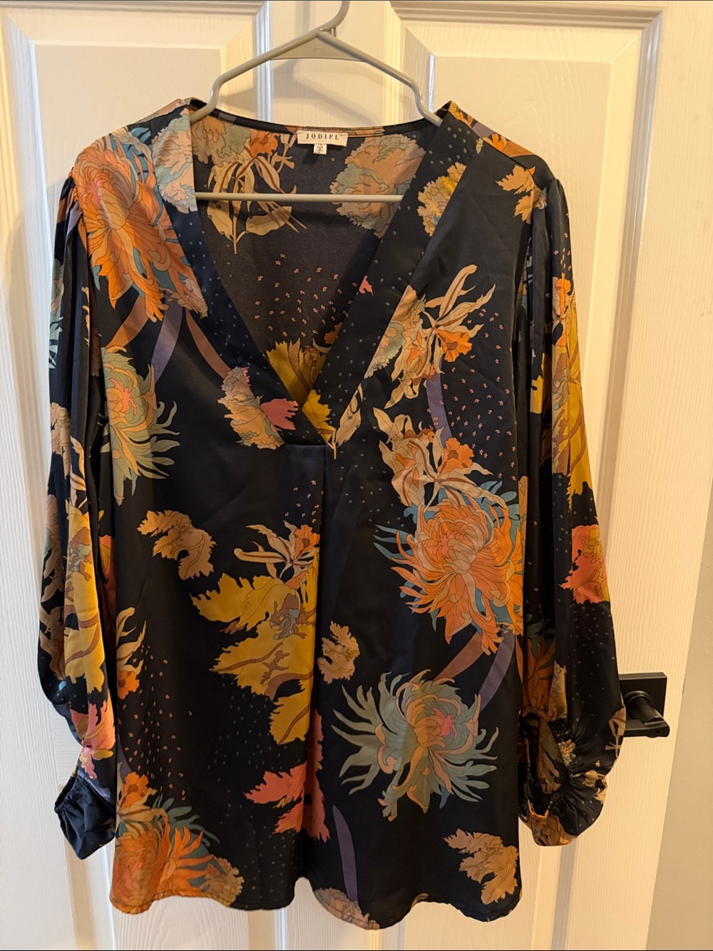 Jodifl Black Floral V-Neck Blouse with Orange and Yellow Accents